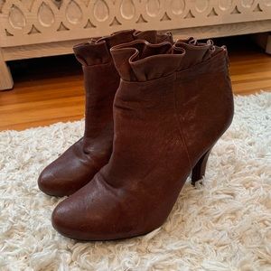 Brown faux healed leather boots with ruffle detail
